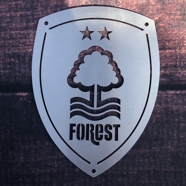 Nottingham Forest Football Club 15x20cm Stainless Steel Wall Shield by Great British Outdoor Fires on a fence
