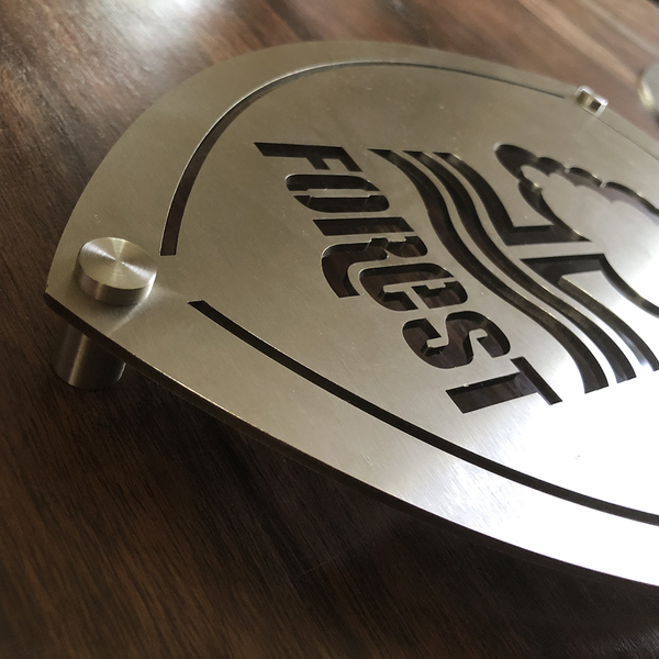 Nottingham Forest Football Club 23x30cm Stainless Steel Wall Shield by Great British Outdoor Fires close up of wall fixing
