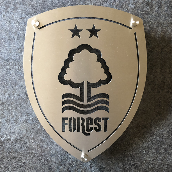 Nottingham Forest Football Club 23x30cm Stainless Steel Wall Shield by Great British Outdoor Fires on a dark background
